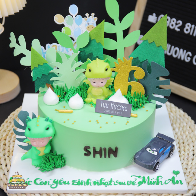 Bánh sinh nhật khu vườn khủng long xanh mướt