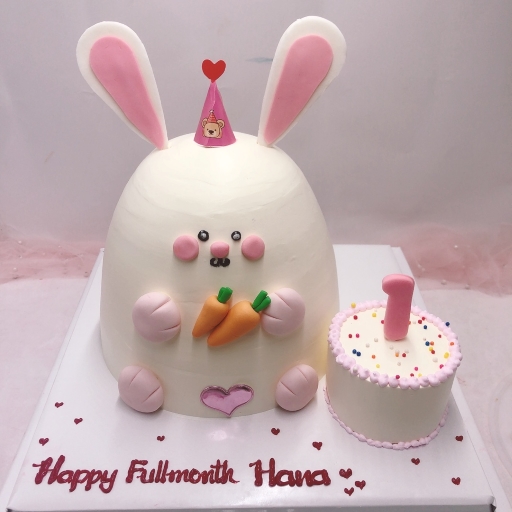 Tạo hình con thỏ ngồi cạnh chiếc bánh kem nhỏ xinh